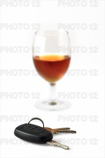 Car key and glass with alcohol
