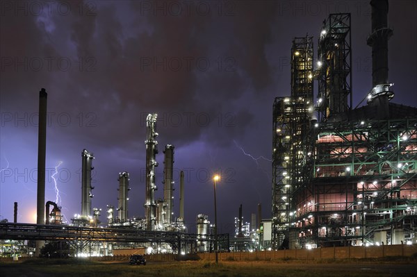 Lightning during thunderstorm above petrochemical industry in the Antwerp harbour at night