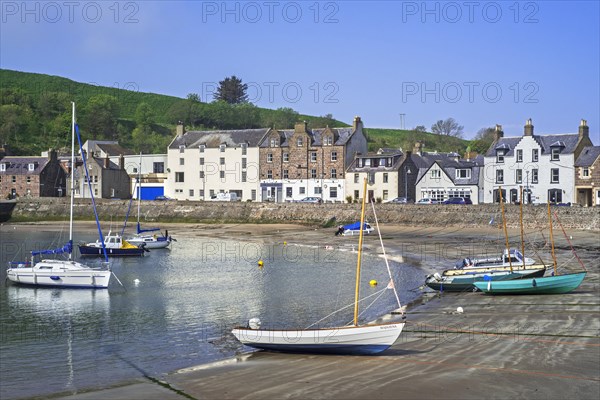 Sailing boats at low tide and hotels