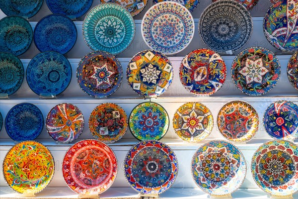 Souvenir shop with the sale of colorful plates in the city of Gjirokaster or Gjirokastra. Albanian