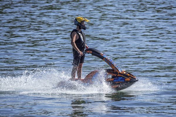 Jet skier riding jet ski