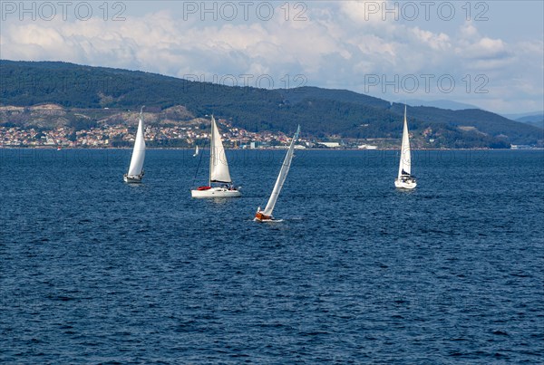 Small boat sailing in estuary of Ria de Vigo