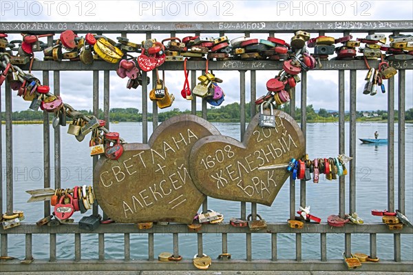 Padlocks on Bridge of Love where married couples hang their padlock and throw away the key in the Angara river in Irkutsk