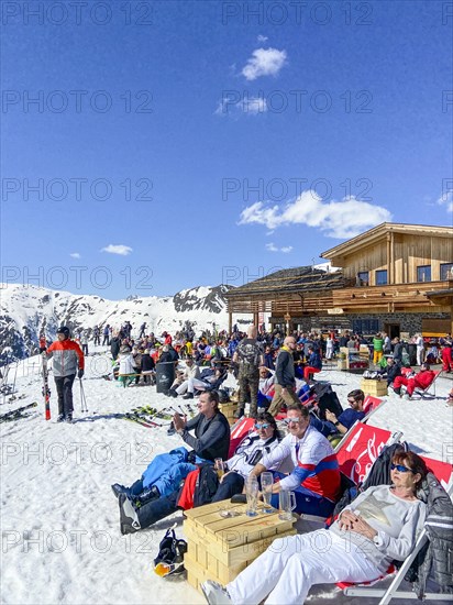 Sunbathing in front of the Vider Alp mountain restaurant