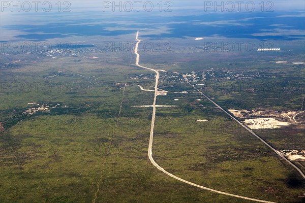 Oblique angle aerial view plane window over new railway tracks of Train Maya