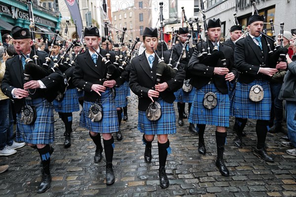 Members of the Clew Bay pipe band march through Temple Bar during the Tradfest