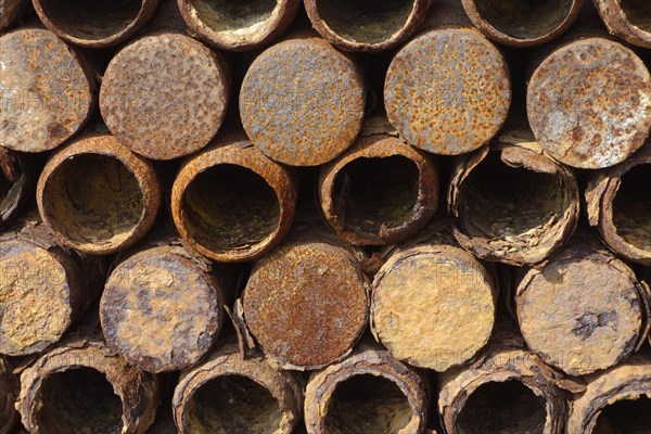 Stacked rusty First World War One artillery grenade shells