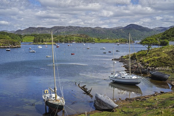 Sailing boats in natural harbour at Badachro near Gairloch on the shore of Gair Loch