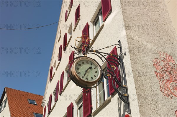 Clock on house wall