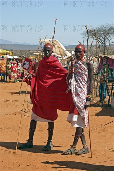 Portrait of Samburu warriors in traditional red dress at market