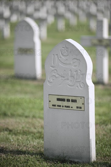 Muslim stele among French graves on the First World War One cemetery Cimetiere National Francais de Saint-Charles de Potyze near Ypres