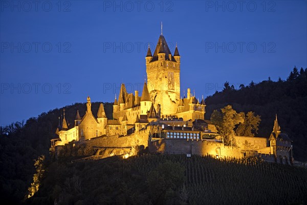 Illuminated Reichsburg Cochem in the evening