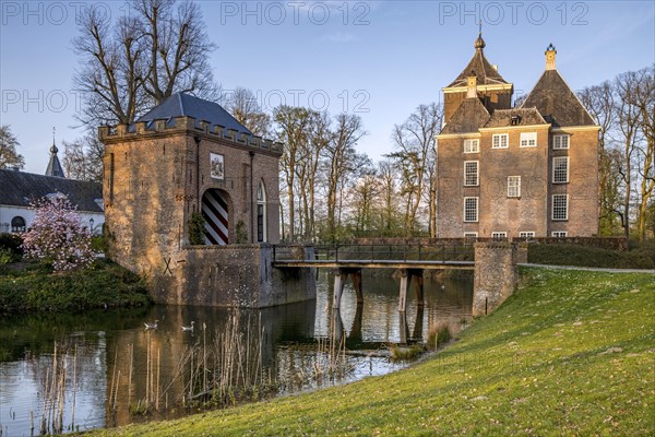 Medieval castle Soelen with gatehouse and bridge over moat at Buren in spring