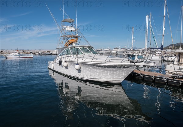 A paradise for pleasure boaters. This yacht is moored in the harbour of L'ile-Rousse in the north-west of the Mediterranean island of Corsica