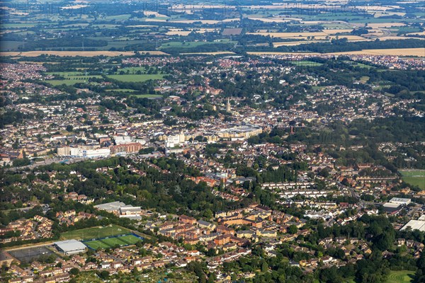 Oblique aerial view through plane window of Bishop's Stortford town