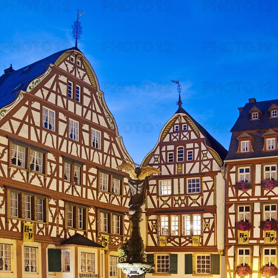 Gabled half-timbered houses on the medieval market square in the evening