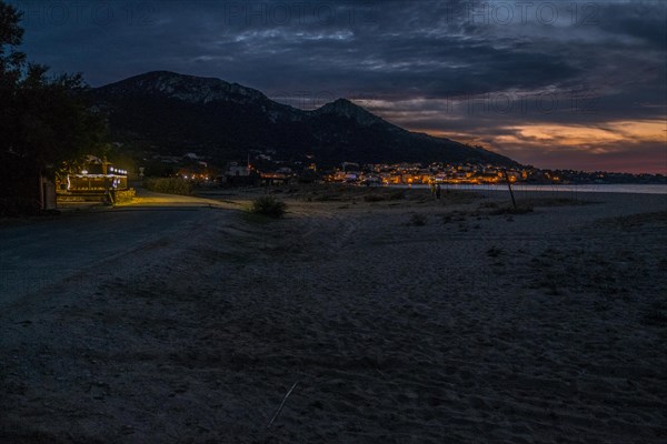 Illuminated Corsican village at sunset on the west side of the Mediterranean island of Corsica