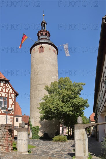 Historic tower with German national flag at the Kurmainzisches Schloss