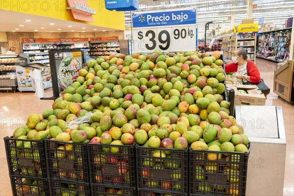 Goods and produce on display inside Walmart superstore shop store