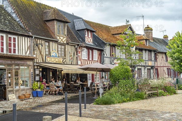 Half-timbered houses and cafes in one of the most beautiful villages in France Beuvron-en-Auge