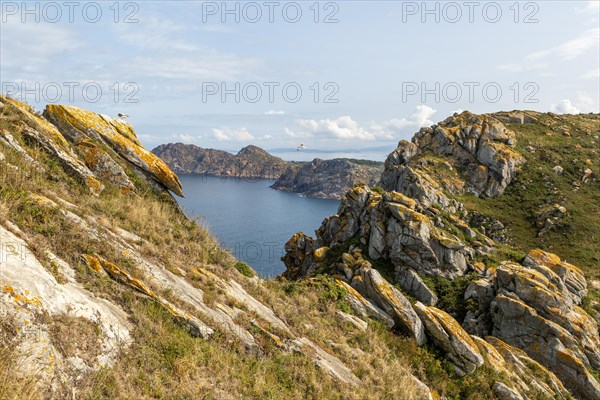 West facing steep cliffs view north from Isla del Faro