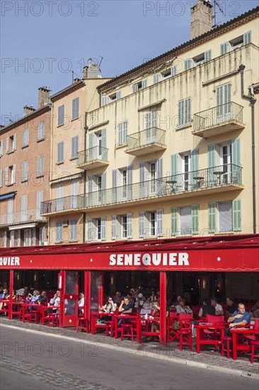 Tourists sitting in cafe Senequier in the vieux port