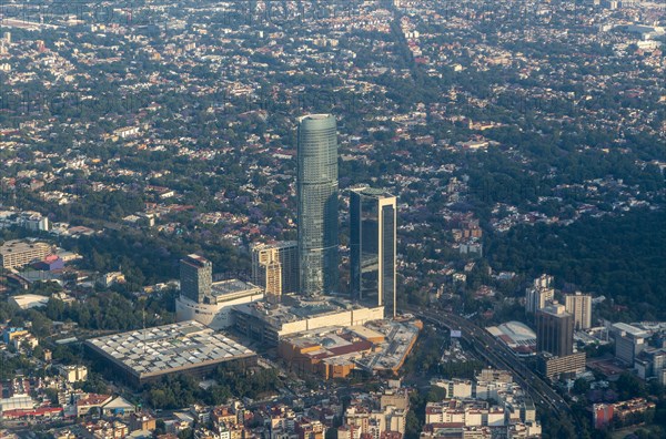 Oblique angle view through plane window new high rise buildings