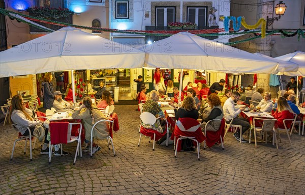 Outdoor restaurant in Alfama by night