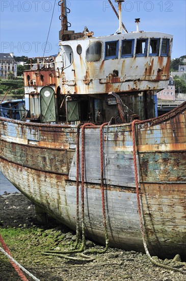 Wreck of small trawler fishing boat in the harbour of Camaret-sur-Mer