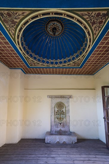 Historic fountain with stylised vault