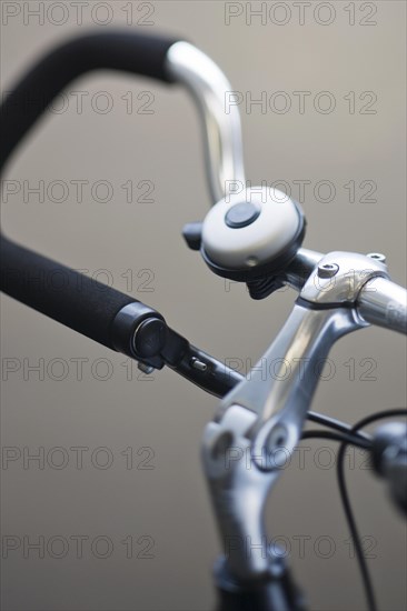 Close up of bike bell mounted on trekking bars