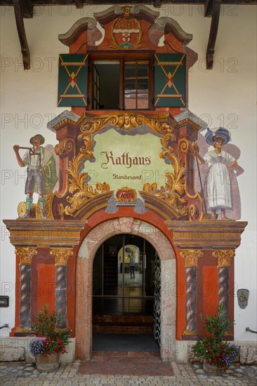 Entrance and facade with Lueftl painting at the town hall and registry office in Ruhpolding