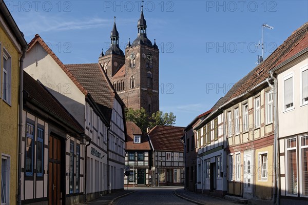 Half-timbered houses in Beusterstrasse and St. Peter's Church in Seehausen