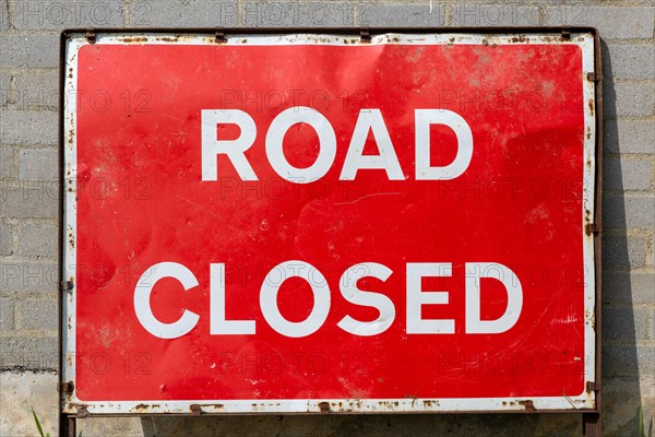 Red rectangular sign Road Closed