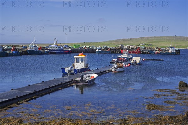 Fish farming workboats in the harbour of Uyeasound on the Isle of Unst