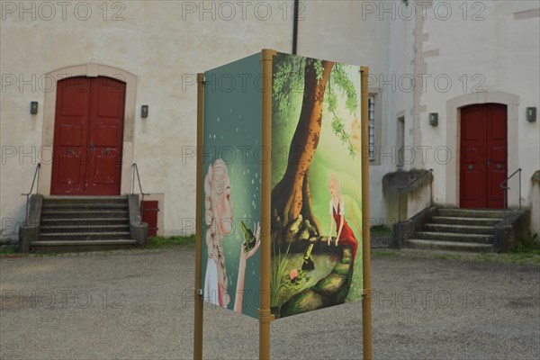 Poster for the fairy tale Frog Prince in the courtyard of the Deutschordenschloss