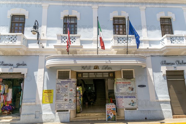 Flags flying on frontage of Hotel Colon