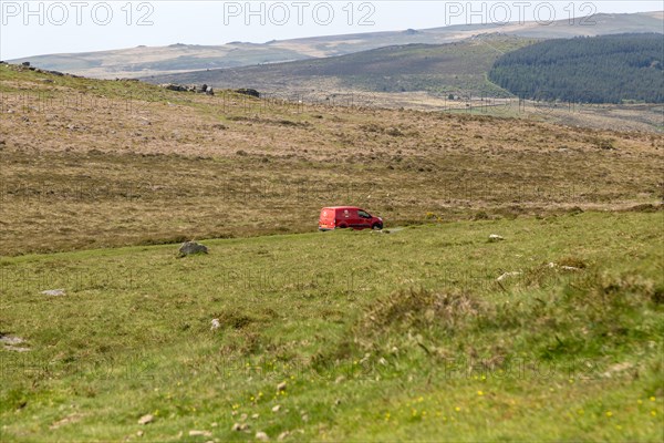 Royal Mail postal red delivery van on moorland road to Babeney