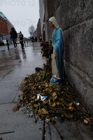 A statue of the Virgin Mary on a rainy day. Dublin