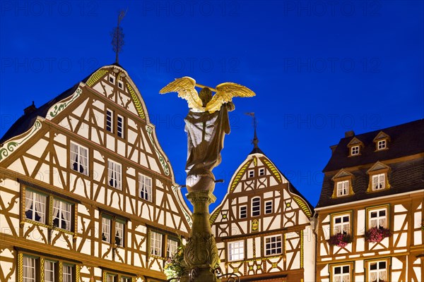 Gabled half-timbered houses with St. Michael's Fountain