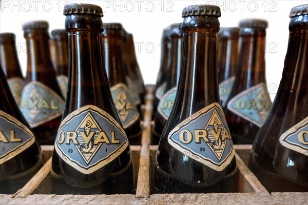 Orval Trappist beer bottles in vintage wooden crate at Orval Abbey