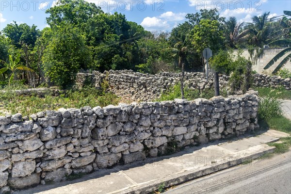 View from bus window of carboniferous limestone stone blocks in dry stone walls