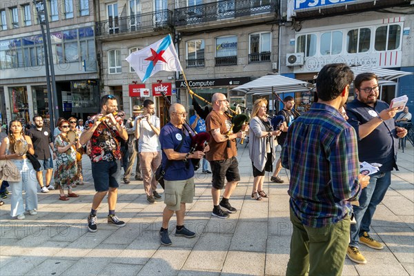 Bagpipe playing musicians BNG political party election campaign in plaza Praza Porto do Sol