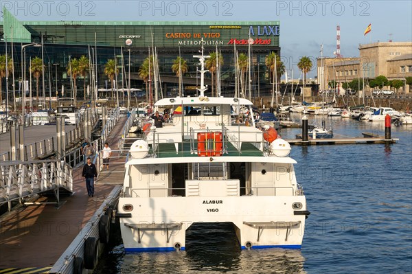 Ferry and sailing yachts in marina