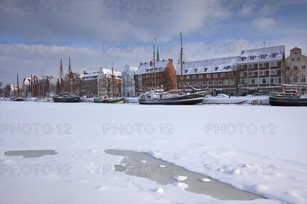 Sailing ship in the snow in winter in the harbour museum at the Hanseatic City of Luebeck