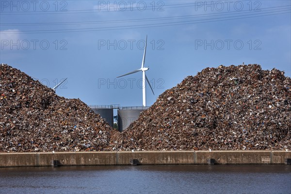 Heaps of recycled scrap metal at Van Heyghen Recycling export terminal in the port of Ghent