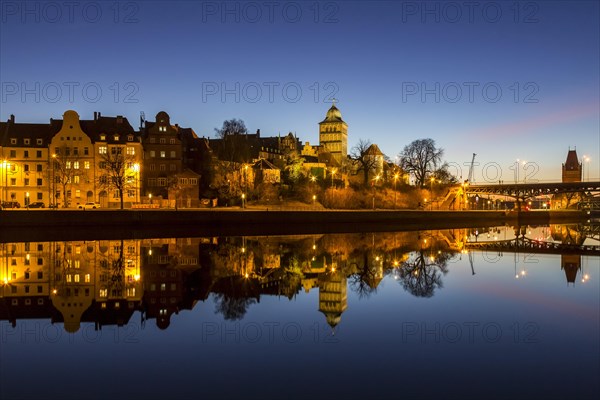 Gothic Burgtor Gate reflected in water of the Elbe Luebeck Canal