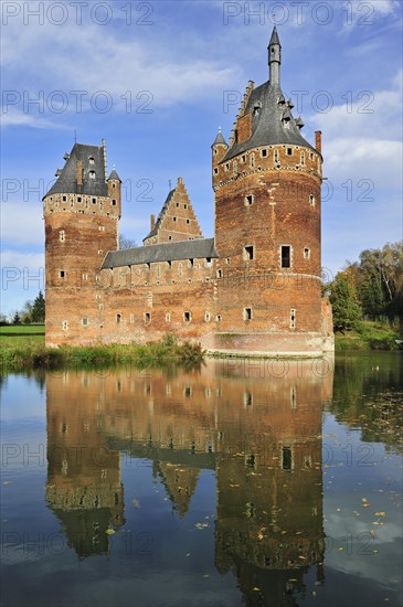 The medieval Beersel Castle reflected in moat