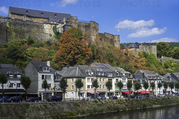 Cafes and restaurants along the Semois river and the medieval Chateau de Bouillon Castle in the city Bouillon