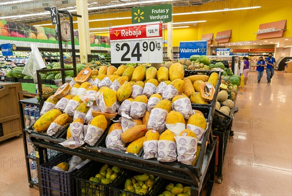 Goods and produce on display inside Walmart superstore shop store